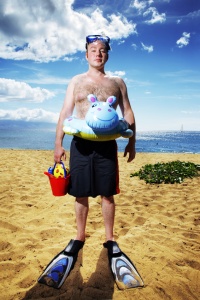 Man ready for fun at sunny tropical beach